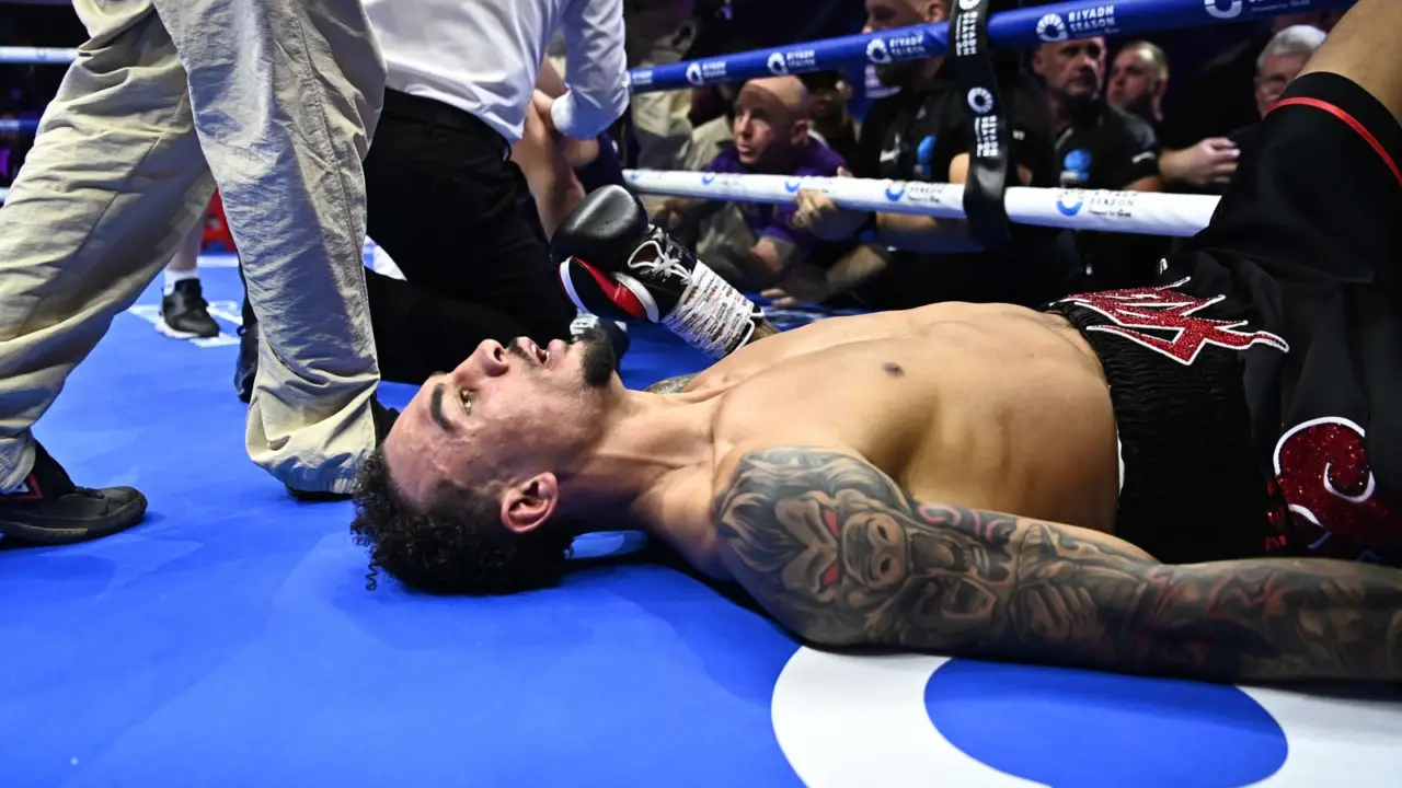 Ben Whittaker lays on the canvas after injuring his ankle.