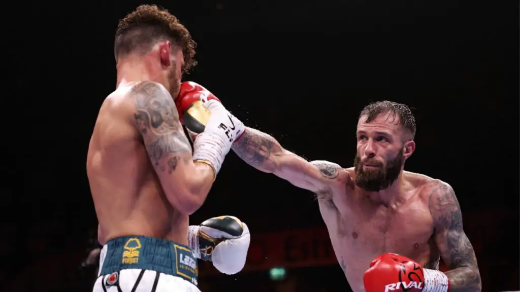 Anthony Cacace Stops Leigh Wood in Ninth Round to Retain IBO Title 2 Image of Anthony Ccace and Leigh Wood during their fight