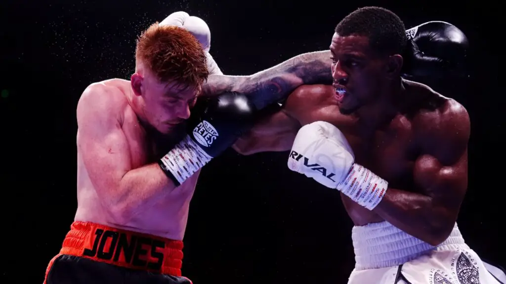 Anthony Cacace Stops Leigh Wood in Ninth Round to Retain IBO Title 3 Image of Ezra Taylor and Troy Jones during their fight