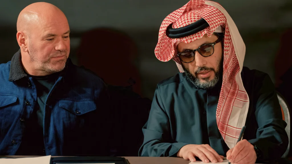 Eddie Hearn Hopeful In His Turki Alalshikh Partnership Amid TKO Uncertainty 2 Image of Turki Al AlShikh and Dana White signing a contract for TKO Boxing