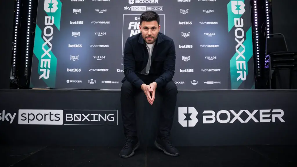 Boxxer Sky Sports Deal Nears End as TNT Sports Boxing Eyes Opportunity 3 image of Ben Shalom sat on a stage presenting Boxxer and Sky Sports Boxing logos