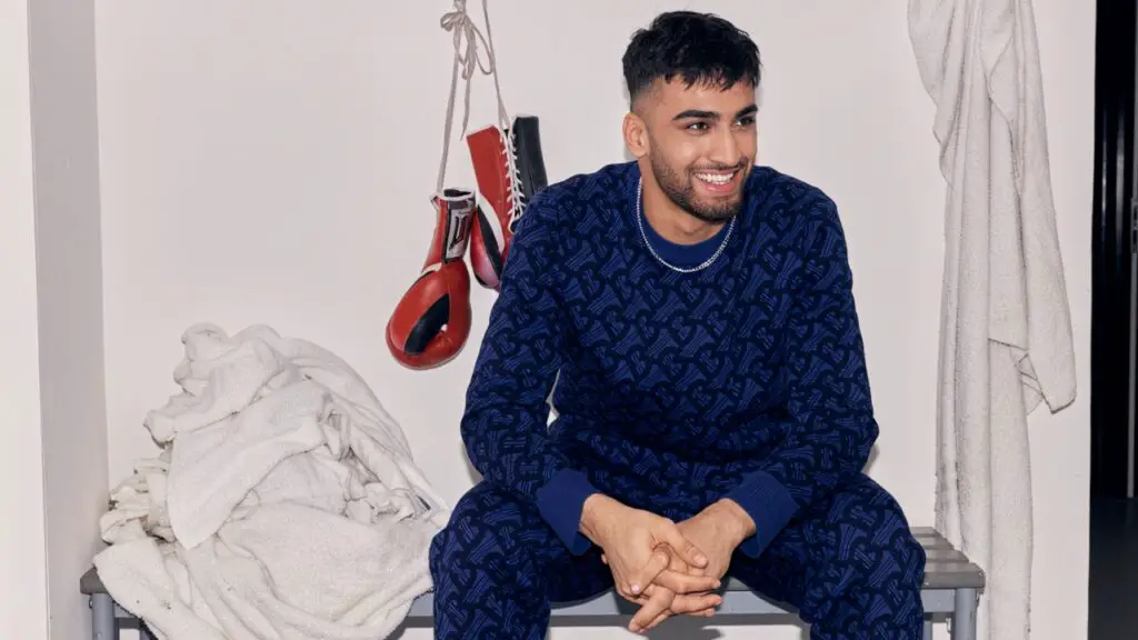 Adam Azim Next Fight Underwhelms As Fans Say His Career is a 'Car Crash' 2 Adam Azim photoshoot in the changing rooms of a gym sat on sa bench