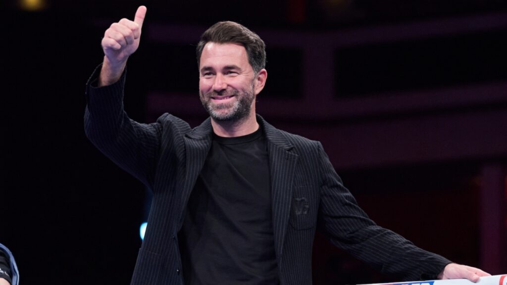 Unveiling Eddie Hearn's Net Worth and How the Boxing Promoter Built His Fortune 5 image of Eddie Hearn celebrating and smiling at fans