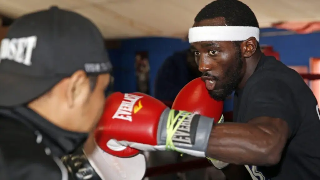 image of Terence Crawford on the pads with one of his trainers in the gym