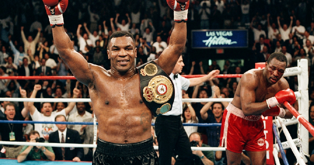 Mike Tyson retains heavyweight belts with sixth-round TKO of Pinklon Thomas