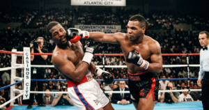 Mike Tyson vs Michael Spinks: Mike Tyson knocks out Michael Spinks in 91 seconds to unify heavyweight titles